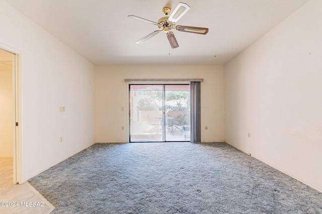 unfurnished room with ceiling fan and light colored carpet