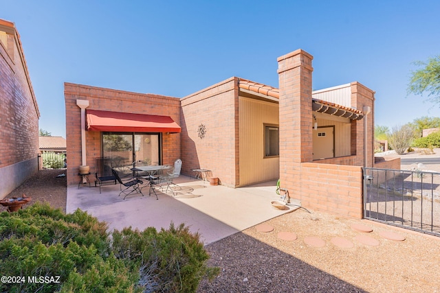 back of house featuring a patio