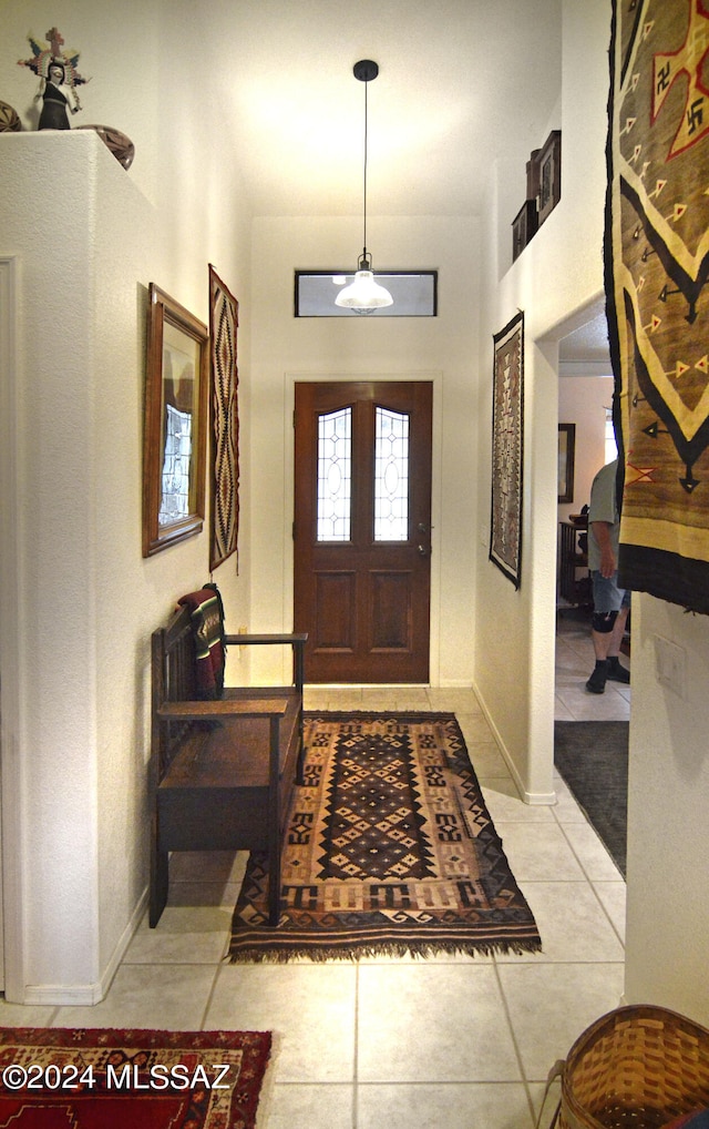 foyer featuring light tile patterned floors