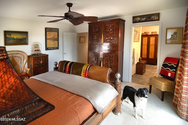 bedroom featuring connected bathroom and ceiling fan