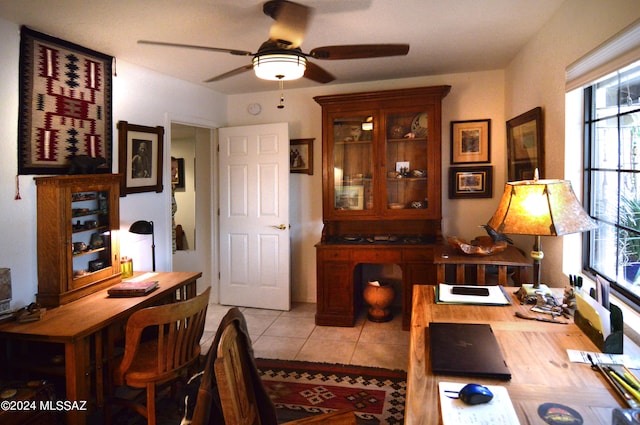 office with ceiling fan and light tile patterned floors