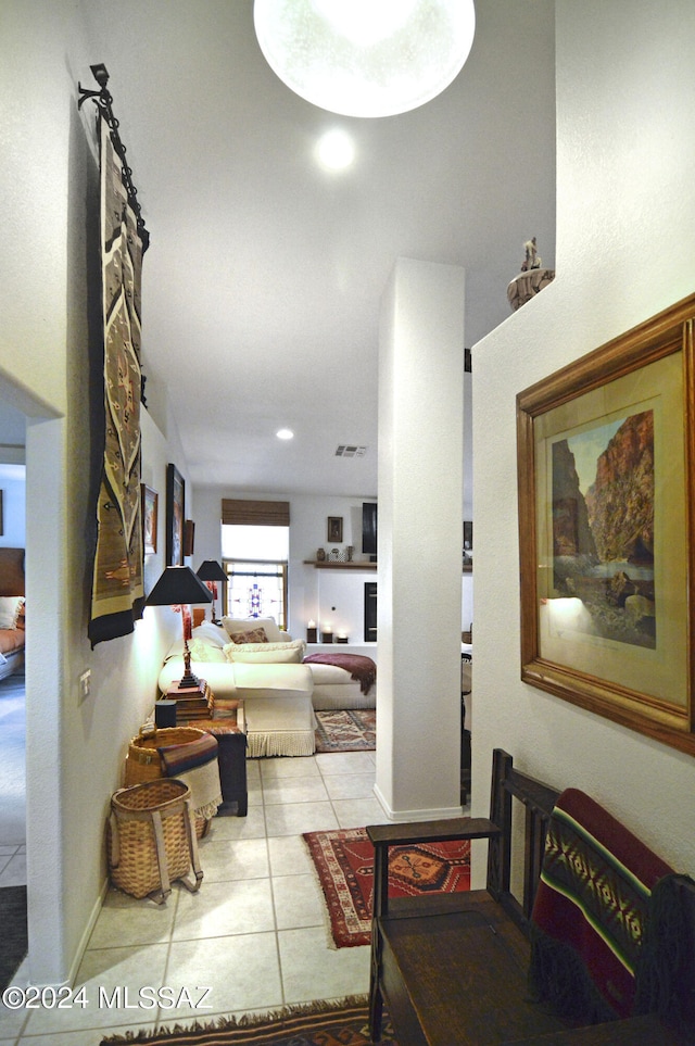 corridor with light tile patterned flooring