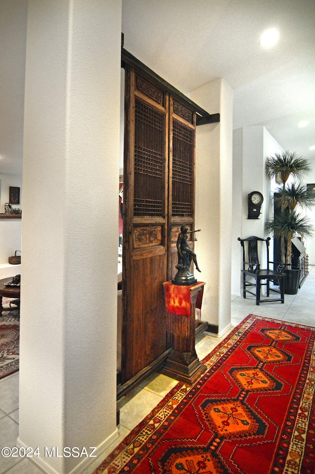 hallway featuring light tile patterned flooring