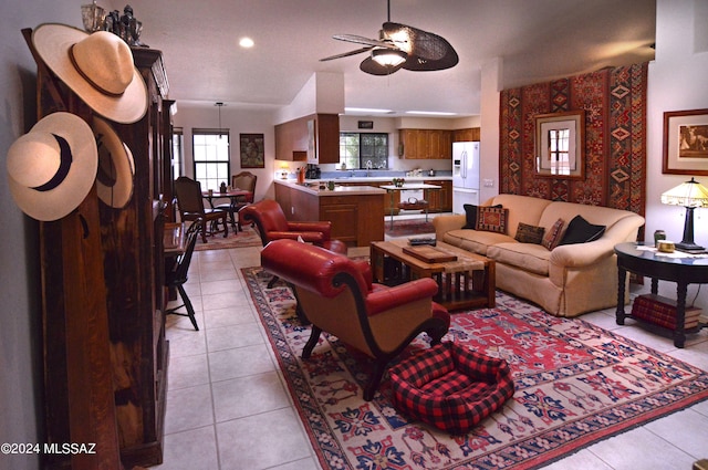 living room with ceiling fan and light tile patterned floors