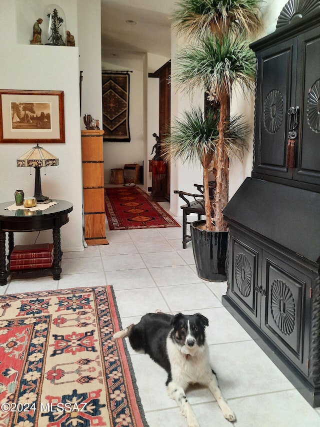 hall featuring light tile patterned floors