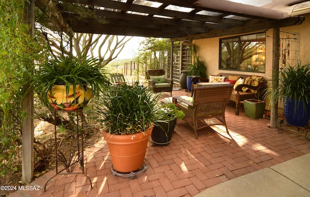 view of patio / terrace featuring a pergola and an outdoor hangout area