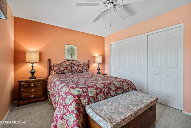 bedroom featuring light carpet, ceiling fan, and a closet