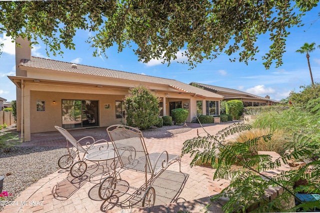 back of house with a patio area