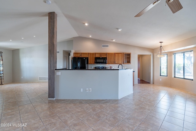 kitchen featuring light tile patterned flooring, black appliances, lofted ceiling, ceiling fan, and decorative light fixtures