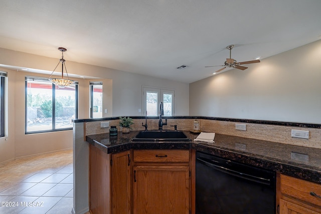 kitchen with dishwasher, light tile patterned flooring, sink, decorative light fixtures, and ceiling fan