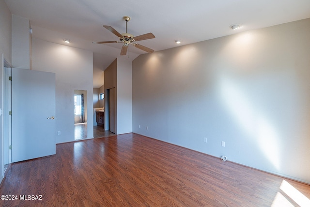 unfurnished room with high vaulted ceiling, wood-type flooring, and ceiling fan