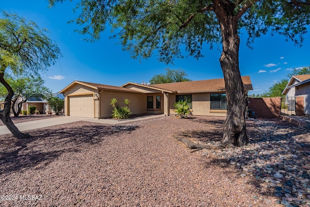 single story home with a garage