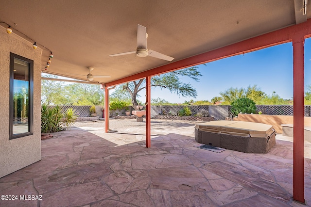 view of patio with a hot tub and ceiling fan