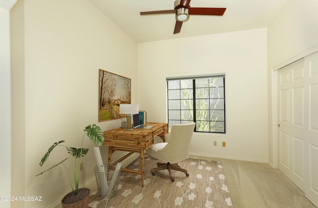 office space with light carpet and ceiling fan