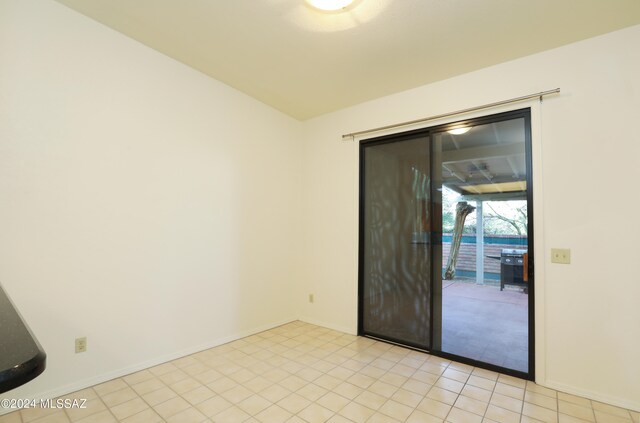 empty room with light tile patterned floors