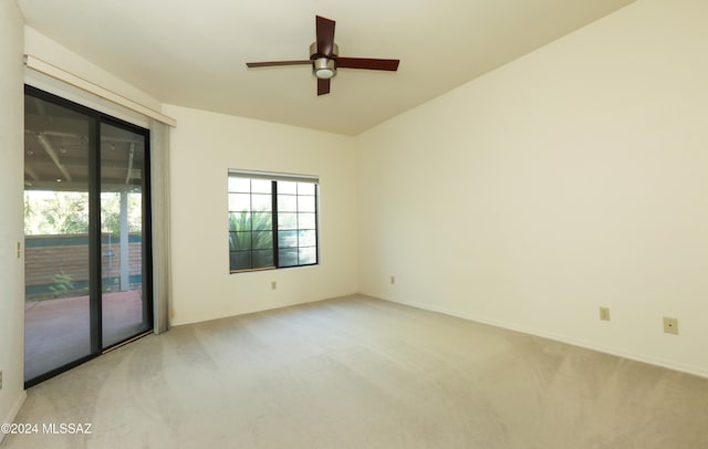 unfurnished room with ceiling fan and carpet