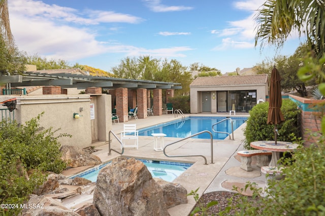 view of swimming pool featuring a patio area