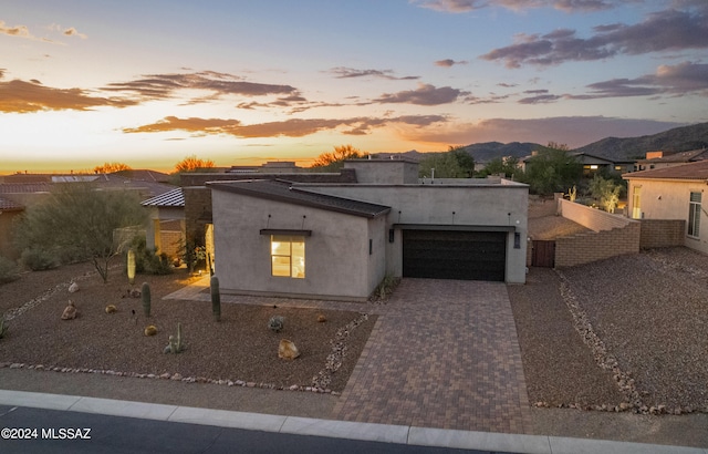 view of front of property featuring a mountain view and a garage