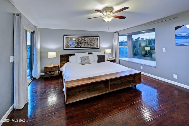 bedroom with dark hardwood / wood-style floors and ceiling fan