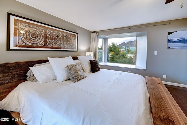 bedroom featuring hardwood / wood-style flooring and ceiling fan