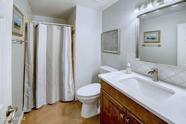 bathroom featuring toilet, walk in shower, vanity, and backsplash