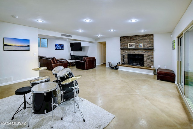 living room with a stone fireplace