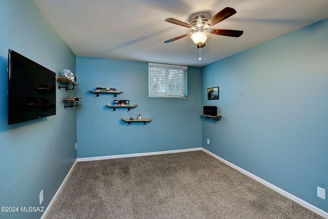 interior space with carpet flooring and ceiling fan