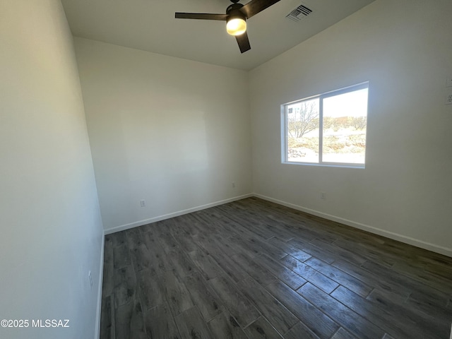 spare room featuring ceiling fan and dark hardwood / wood-style flooring