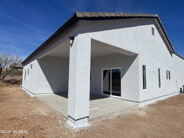 rear view of house with a patio