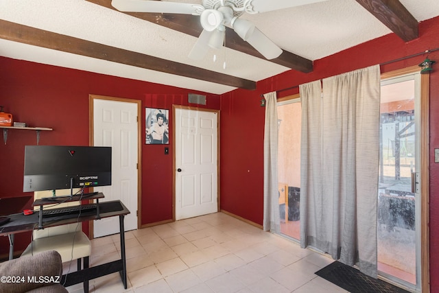 office featuring ceiling fan, beamed ceiling, light tile patterned floors, and a textured ceiling