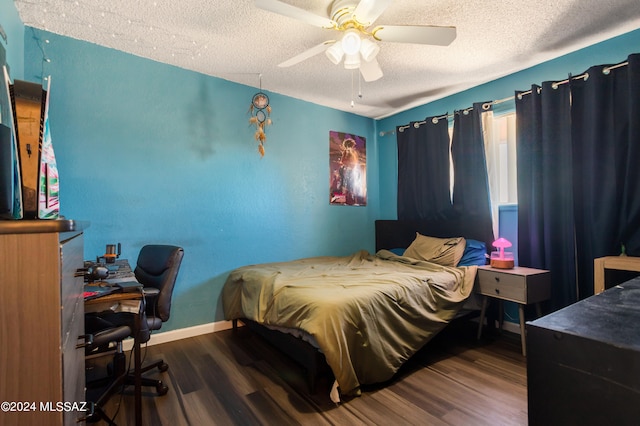 bedroom featuring a textured ceiling, ceiling fan, and hardwood / wood-style flooring