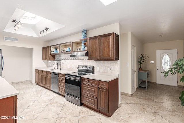 kitchen with appliances with stainless steel finishes, tasteful backsplash, light tile patterned floors, ventilation hood, and sink