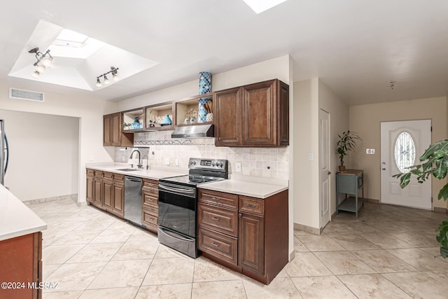 5731 E 2nd St, Tucson, AZ 85711 - kitchen featuring a sink, stainless steel appliances, exhaust hood, and a skylight