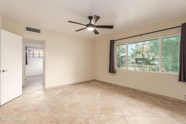 5731 E 2nd St, Tucson, AZ 85711 - spare room featuring a wealth of natural light, visible vents, light tile patterned floors, and ceiling fan