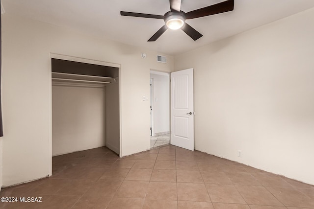 5731 E 2nd St, Tucson, AZ 85711 - unfurnished bedroom featuring light tile patterned floors, a closet, visible vents, and a ceiling fan