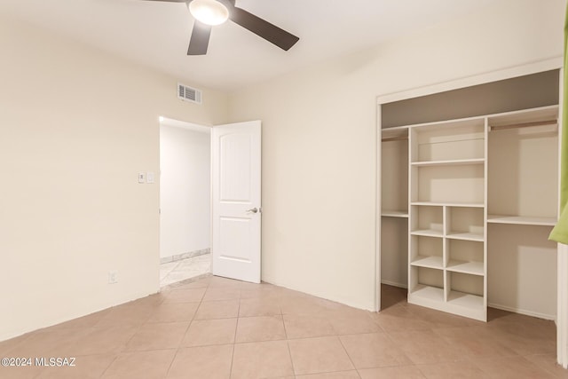 5731 E 2nd St, Tucson, AZ 85711 - unfurnished bedroom with ceiling fan, light tile patterned flooring, a closet, and visible vents