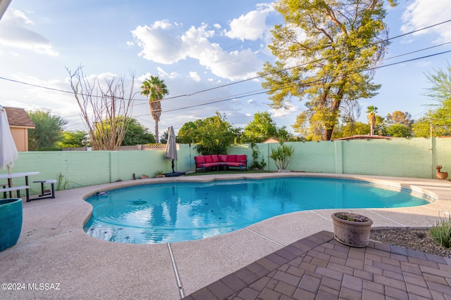 view of swimming pool with a patio