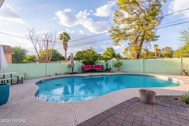 5731 E 2nd St, Tucson, AZ 85711 - view of swimming pool with a fenced backyard, a patio area, a fenced in pool, and outdoor lounge area