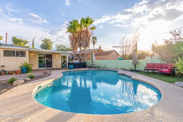 5731 E 2nd St, Tucson, AZ 85711 - view of swimming pool with a patio, a fenced backyard, a fenced in pool, and an outdoor living space