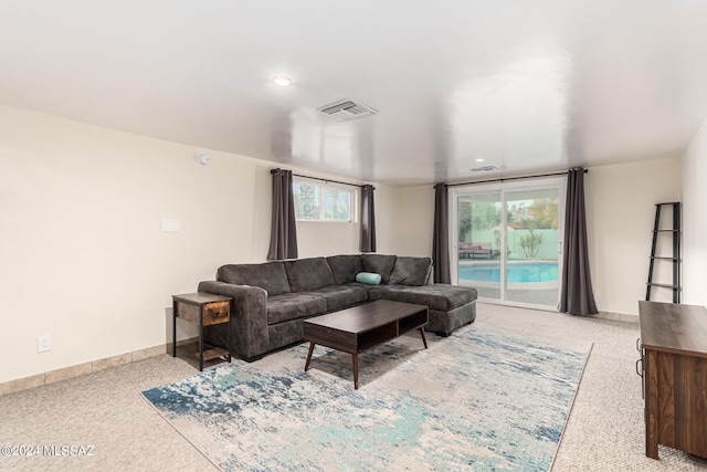 carpeted living room featuring a healthy amount of sunlight