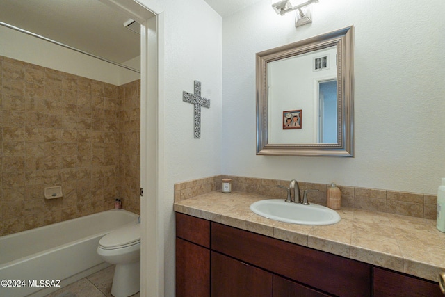 full bathroom with tile patterned floors, vanity, toilet, and tiled shower / bath