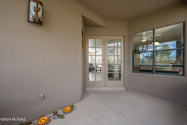 view of exterior entry featuring a patio