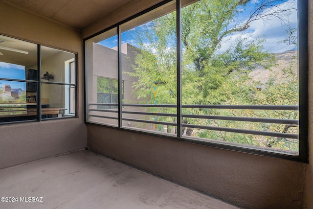 unfurnished sunroom featuring plenty of natural light