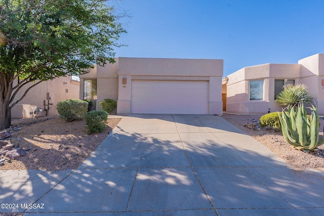 adobe home featuring a garage