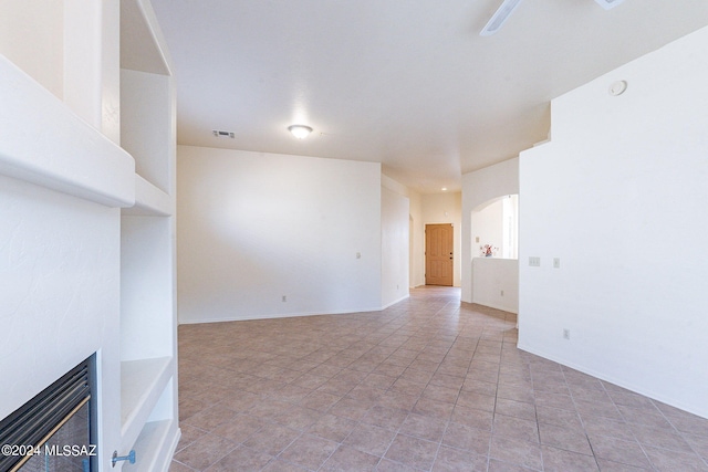 spare room with light tile patterned floors