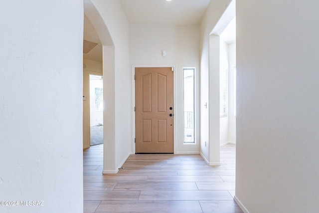 entrance foyer featuring a healthy amount of sunlight and light wood-type flooring