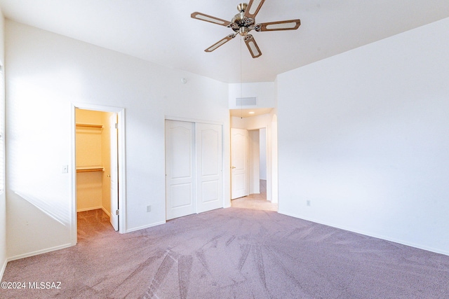 unfurnished bedroom featuring light colored carpet and ceiling fan