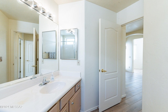 bathroom with vanity and hardwood / wood-style flooring