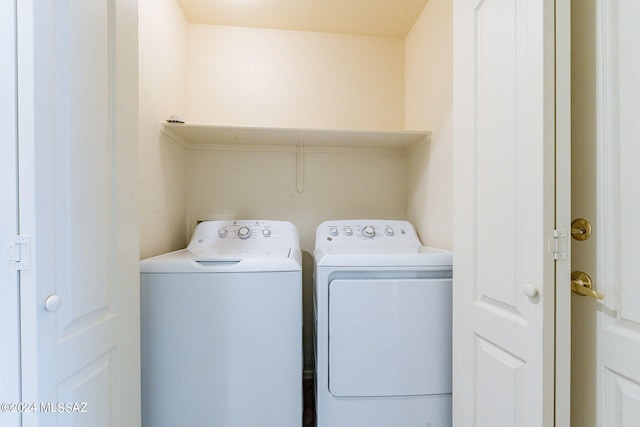 laundry room with separate washer and dryer