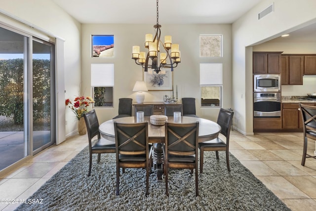 dining space featuring an inviting chandelier